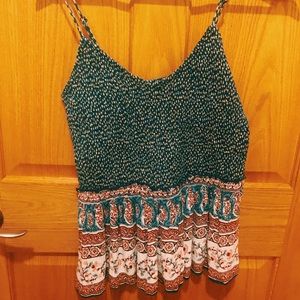 Green tank top with with little different patterns I have only worn once